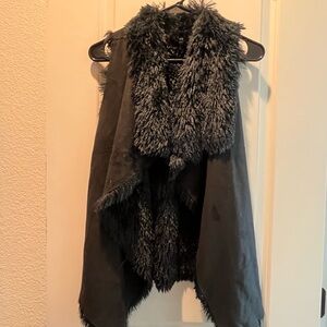 Gorgeous black vest to wear, warm, fits like size Small